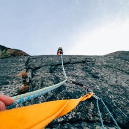 ropes up a cliff with a person ahead climbing News Article