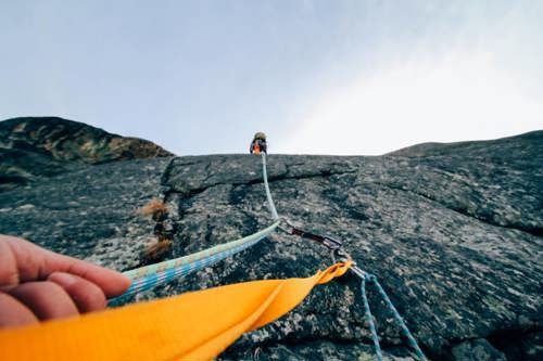 ropes up a cliff with a person ahead climbing News Article