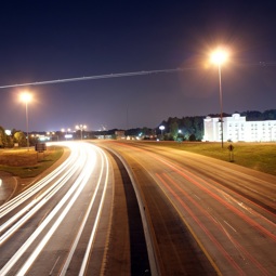 Highway at night with lights from the cars News Article