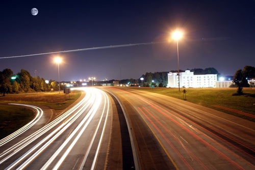 Highway at night with lights from the cars News Article