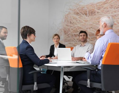 Group of people around a boardroom table